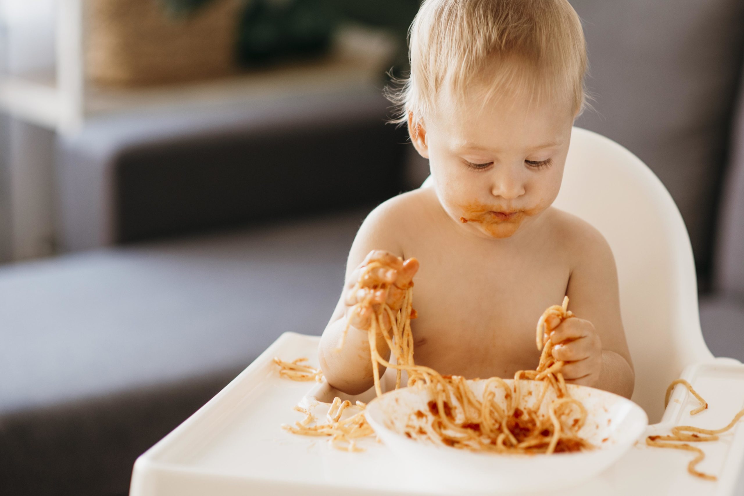 baby eating messy food